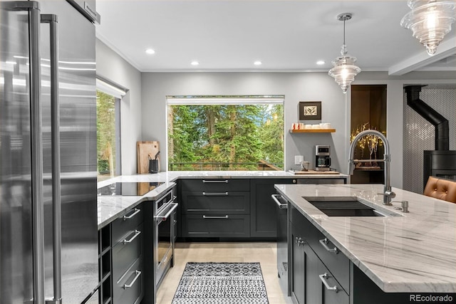 592 Brook Dr, Idaho Springs, CO 80452 - kitchen with stainless steel appliances, healthy amount of natural light, light stone counters, recessed lighting, and hanging light fixtures