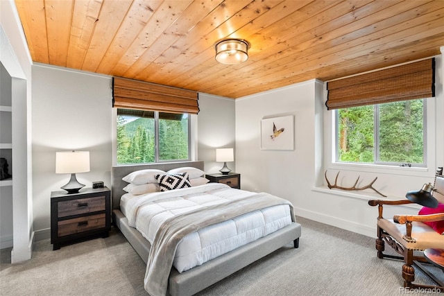 592 Brook Dr, Idaho Springs, CO 80452 - carpeted bedroom featuring wood ceiling and multiple windows