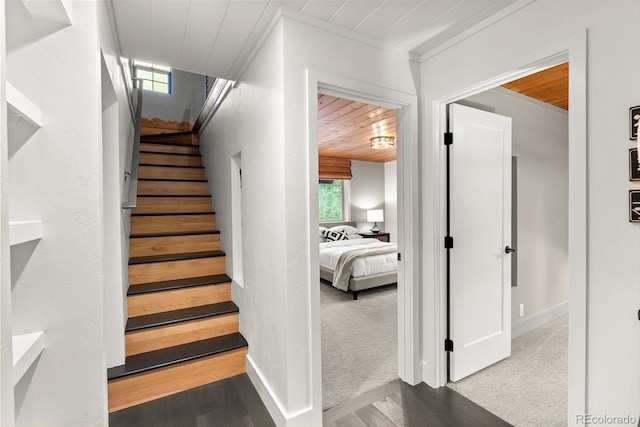 592 Brook Dr, Idaho Springs, CO 80452 - staircase featuring wood ceiling, wood finished floors, and crown molding