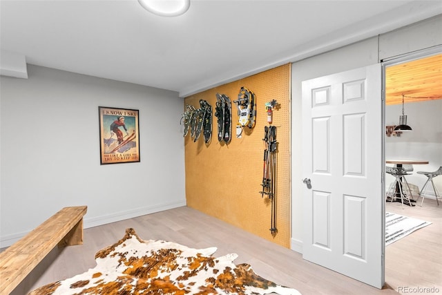 592 Brook Dr, Idaho Springs, CO 80452 - interior space featuring light wood-style flooring and an accent wall