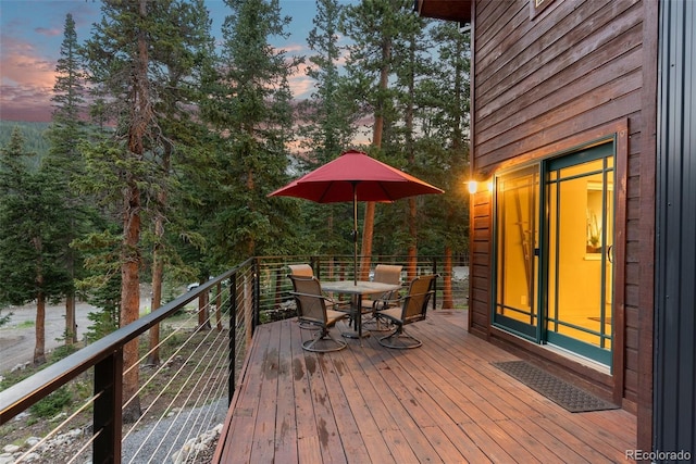 592 Brook Dr, Idaho Springs, CO 80452 - deck featuring outdoor dining space and view of scattered trees