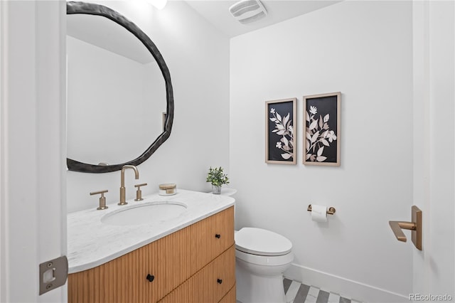 456 Cherry St, Denver, CO 80220 - half bath featuring vanity, toilet, and baseboards