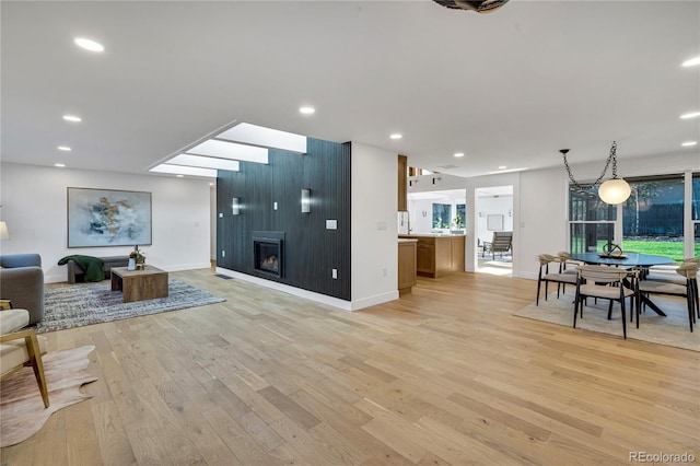 456 Cherry St, Denver, CO 80220 - living area featuring light wood-style flooring, a fireplace, baseboards, and recessed lighting