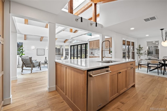 456 Cherry St, Denver, CO 80220 - kitchen featuring a sink, stainless steel dishwasher, light countertops, light wood-style floors, and recessed lighting