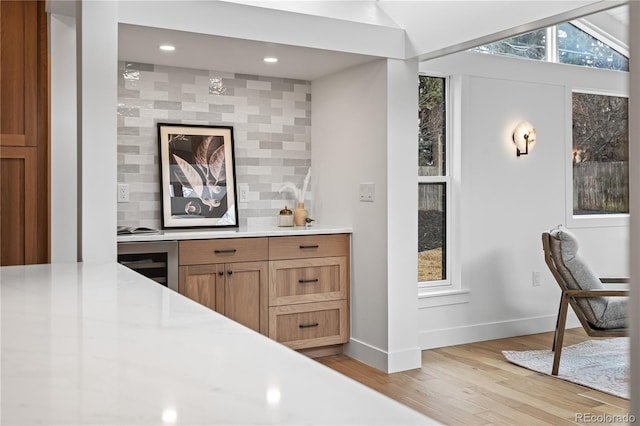 456 Cherry St, Denver, CO 80220 - bar featuring beverage cooler, baseboards, light wood-type flooring, decorative backsplash, and recessed lighting