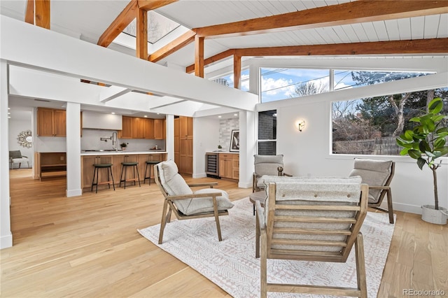456 Cherry St, Denver, CO 80220 - living room with beam ceiling, baseboards, light wood-style flooring, and high vaulted ceiling