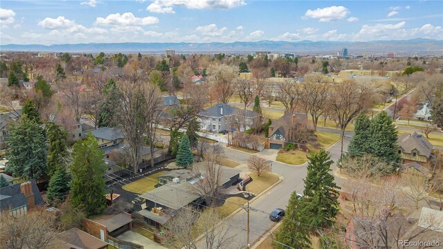 456 Cherry St, Denver, CO 80220 - aerial overview of property's location featuring a mountainous background and nearby suburban area