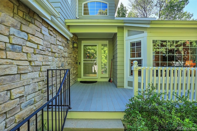 property entrance with a wooden deck