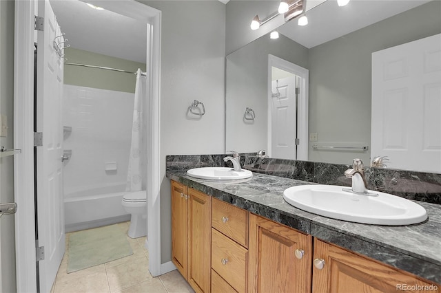 full bathroom with shower / bath combo, tile patterned flooring, vanity, and toilet