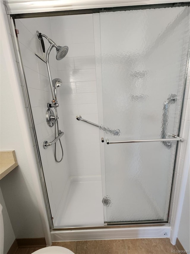 bathroom with a shower stall