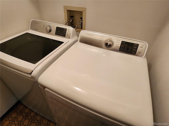 laundry area with laundry area and washing machine and clothes dryer