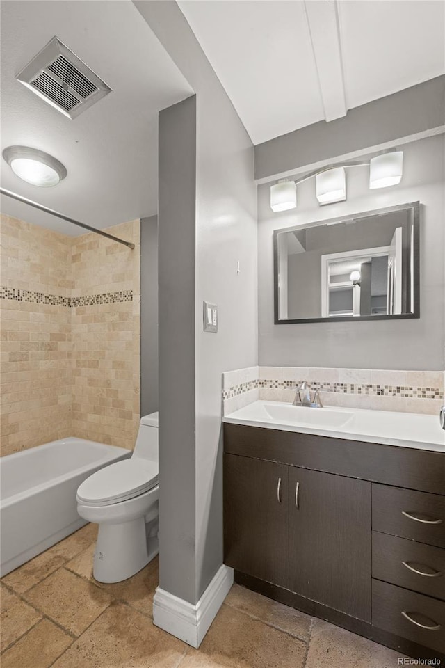 555 E 10th Ave Unit 111, Denver, CO 80203 - full bathroom featuring baseboards, toilet, vanity, shower / washtub combination, and stone tile floors