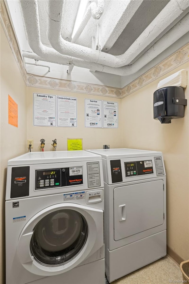 555 E 10th Ave Unit 111, Denver, CO 80203 - shared laundry room featuring washer and clothes dryer