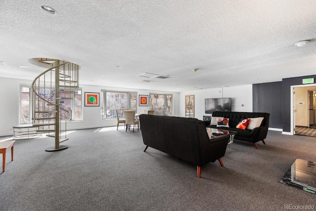 555 E 10th Ave Unit 111, Denver, CO 80203 - carpeted living room with a textured ceiling and baseboards