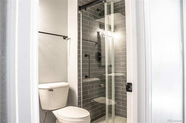 bathroom featuring an enclosed shower and toilet