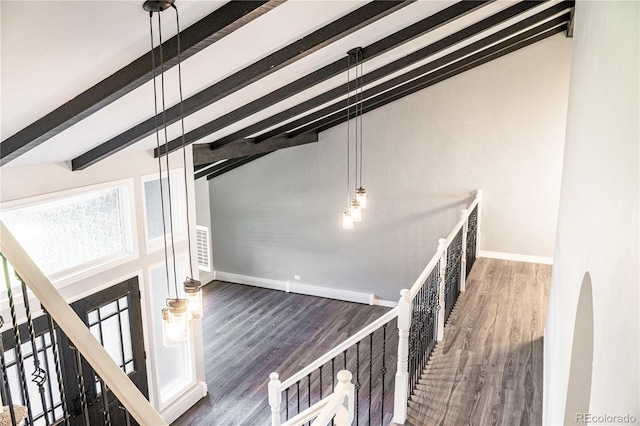 interior space with lofted ceiling with beams and wood-type flooring