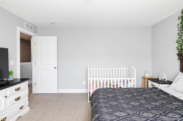 bedroom with light carpet