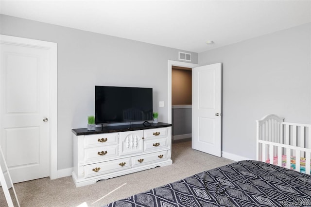 bedroom featuring light colored carpet