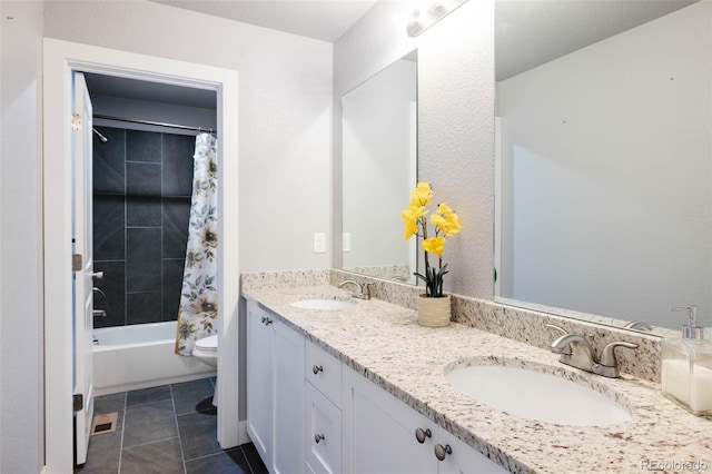 full bathroom with tile patterned flooring, vanity, shower / tub combo with curtain, and toilet