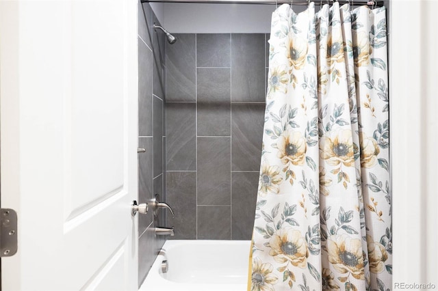 bathroom with shower / bath combo with shower curtain