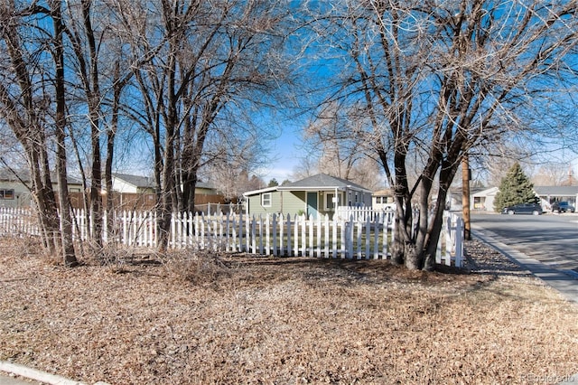 view of yard featuring a residential view and a fenced front yard