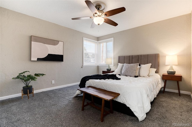 carpeted bedroom featuring ceiling fan, baseboards, and a textured wall