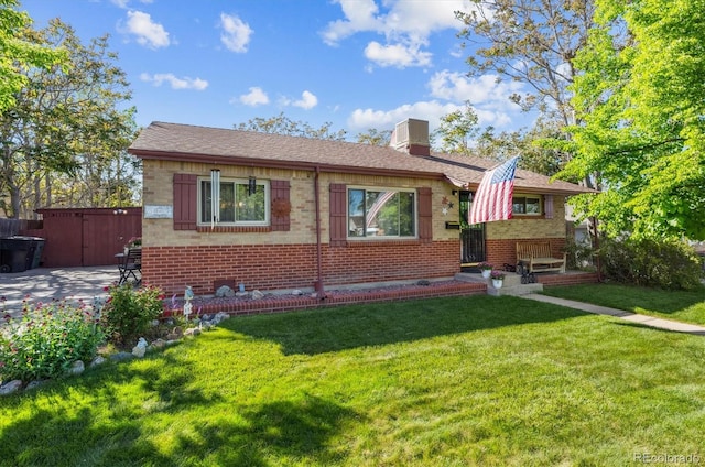 9301 Ciancio St, Thornton, CO 80229 - bungalow-style home featuring brick siding, a front lawn, and a chimney