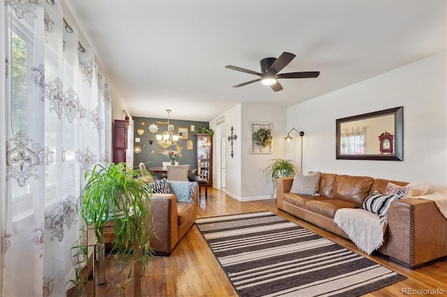 9301 Ciancio St, Thornton, CO 80229 - living room with a chandelier, plenty of natural light, baseboards, and a ceiling fan