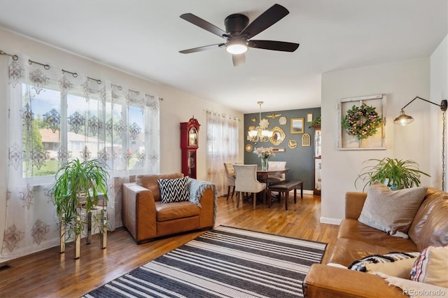 9301 Ciancio St, Thornton, CO 80229 - living area featuring a chandelier, light wood finished floors, and ceiling fan