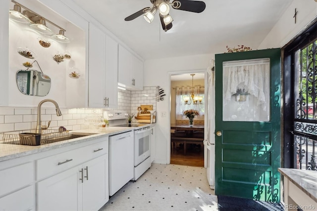 9301 Ciancio St, Thornton, CO 80229 - kitchen with white appliances, a sink, light floors, a chandelier, and ceiling fan