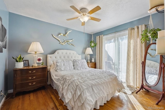 9301 Ciancio St, Thornton, CO 80229 - bedroom featuring wood finished floors, a textured ceiling, a ceiling fan, and baseboards