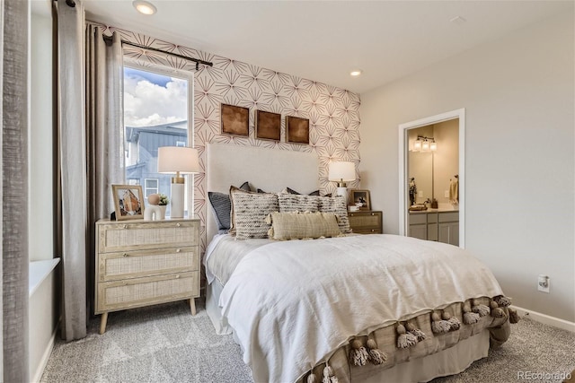 carpeted bedroom with ensuite bath