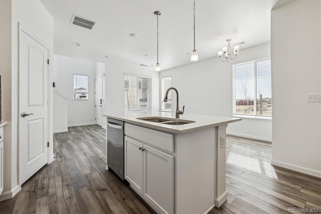 kitchen with dark wood-style floors, a sink, visible vents, and dishwasher