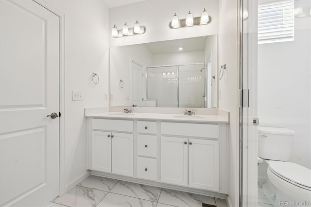 bathroom with toilet, a sink, marble finish floor, double vanity, and a stall shower