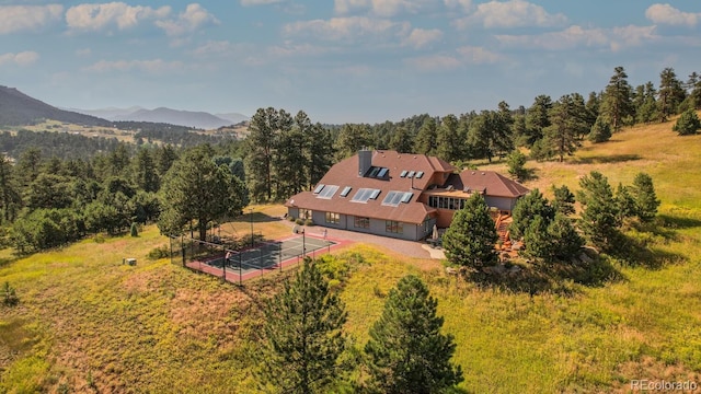 drone / aerial view featuring a mountain view