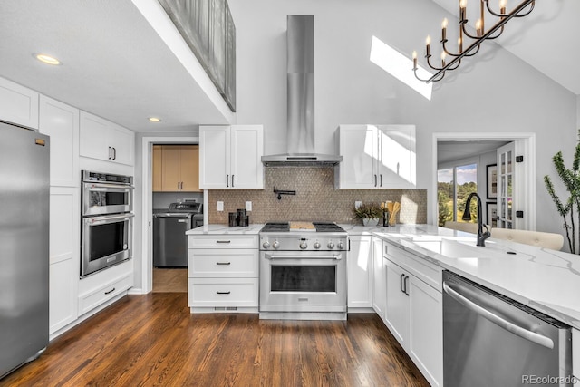 kitchen with sink, exhaust hood, stainless steel appliances, decorative backsplash, and white cabinets