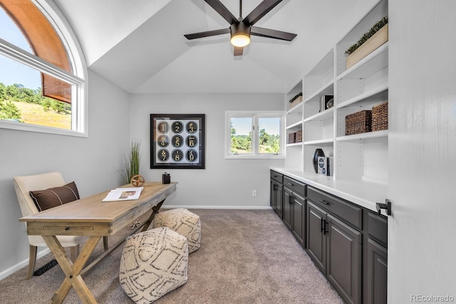 office space featuring light carpet, vaulted ceiling, and ceiling fan