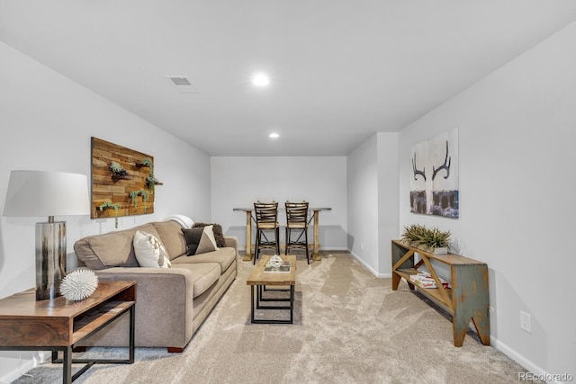 living room featuring light carpet