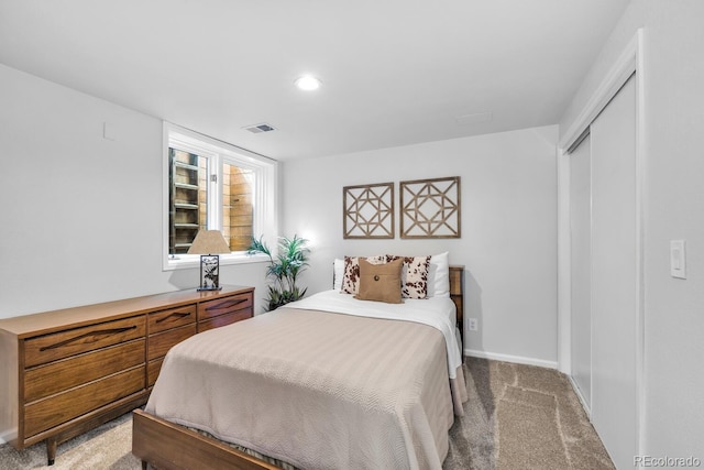 bedroom featuring a closet and carpet