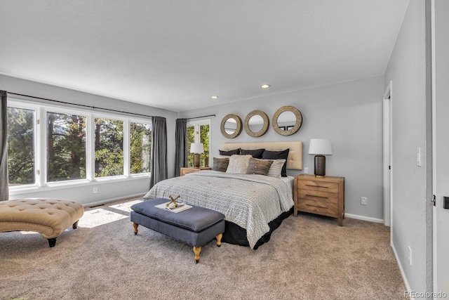 bedroom featuring light colored carpet