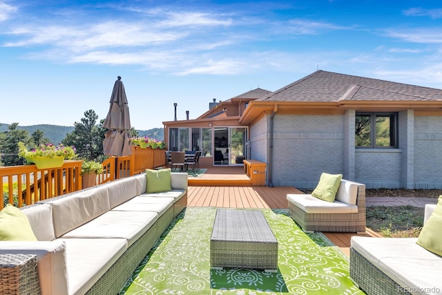 exterior space with a mountain view and an outdoor hangout area