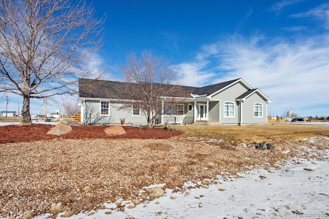 ranch-style house with covered porch