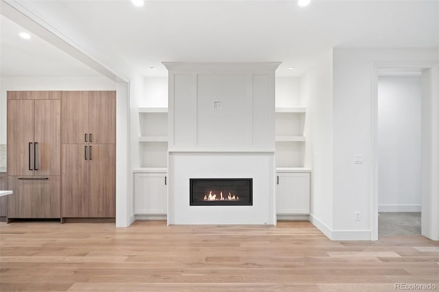 unfurnished living room featuring light hardwood / wood-style floors