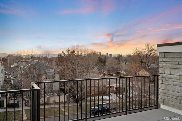 view of balcony at dusk