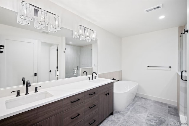 bathroom featuring vanity and shower with separate bathtub