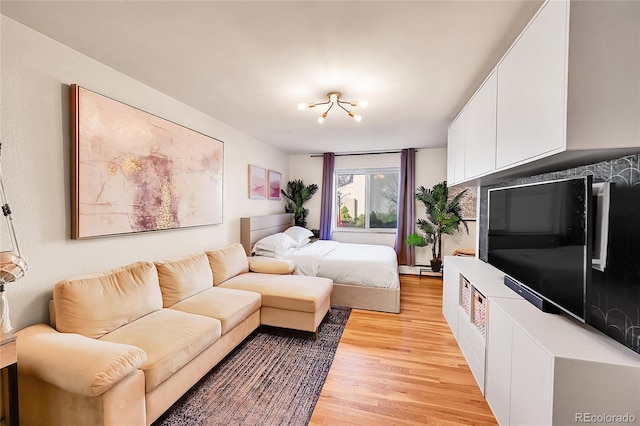 bedroom with light wood finished floors