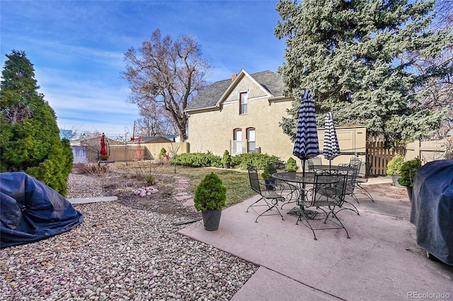 view of patio / terrace with grilling area and fence