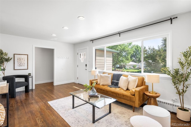 5167 S Pearl St, Littleton, CO 80121 - living area with wood finished floors, recessed lighting, and a baseboard radiator