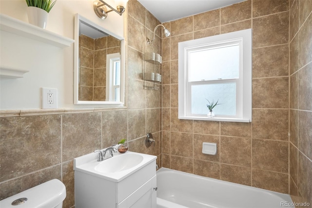 5167 S Pearl St, Littleton, CO 80121 - bathroom featuring vanity,  shower combination, tile walls, and plenty of natural light