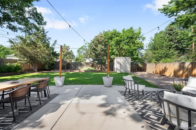 5167 S Pearl St, Littleton, CO 80121 - fenced backyard featuring a storage shed, outdoor dining area, and a patio